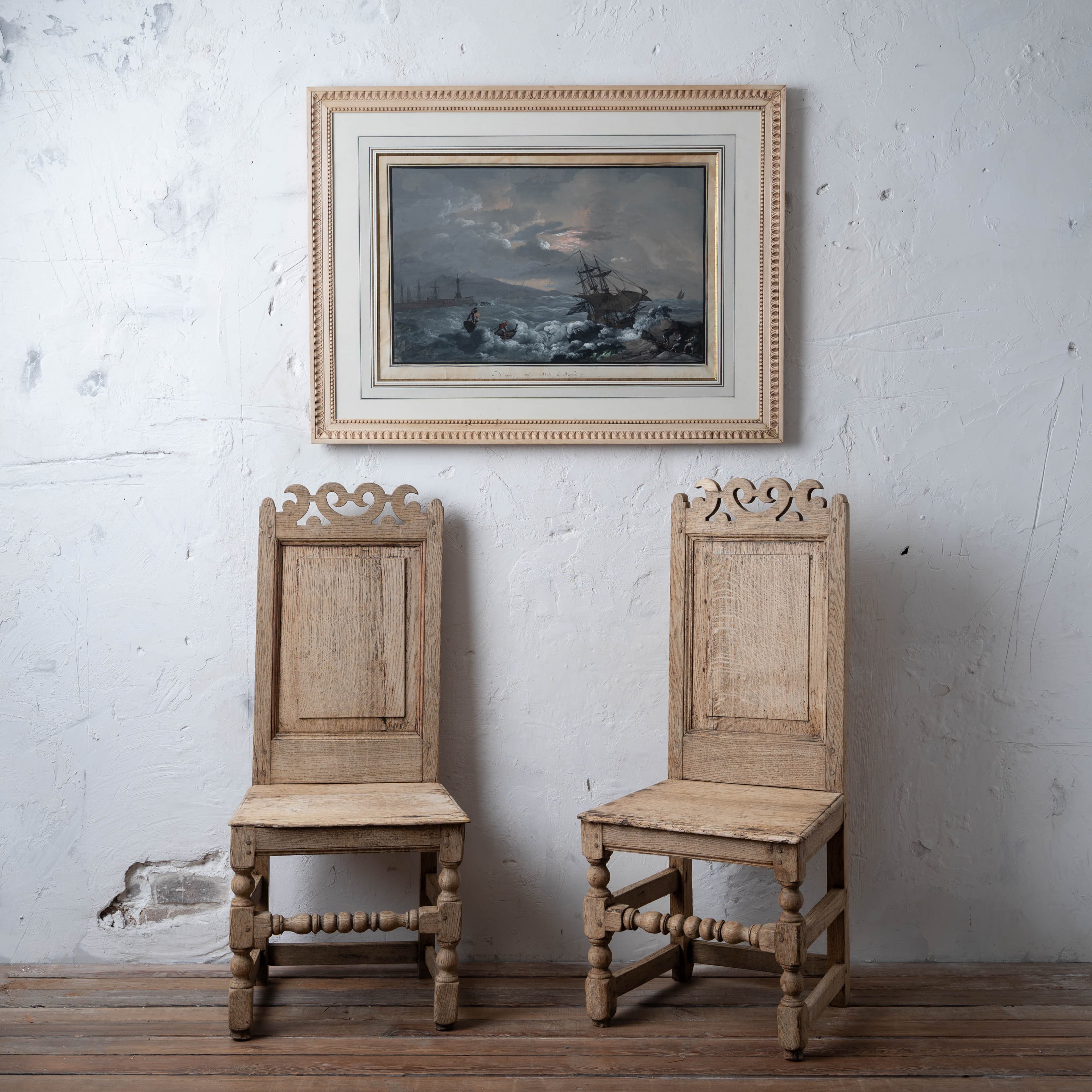 A pair of 17th-century oak back stools beneath Camillo de Vito's View from Naples Pier